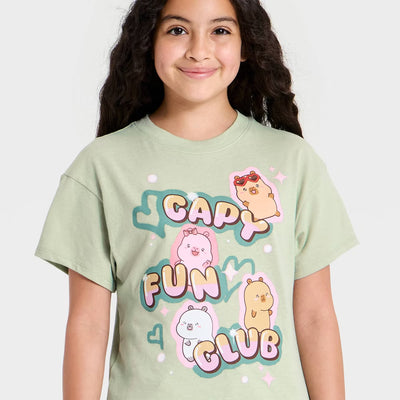 Girl wearing a CapyFun t-shirt with the capybara friends