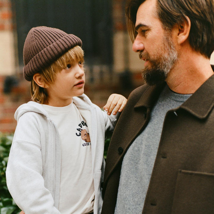 Father and son in CapyFun capybara apparel