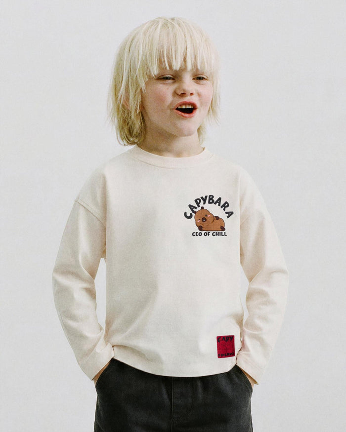 Boy wearing a CapyFun capybara sweatshirt