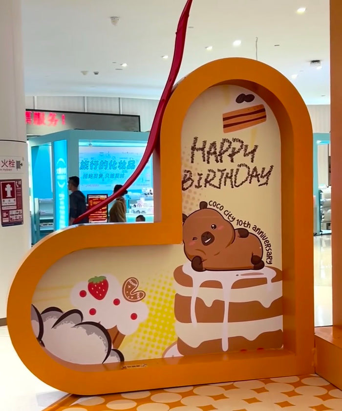 CapyFun capybara birthday display at a shopping mall event