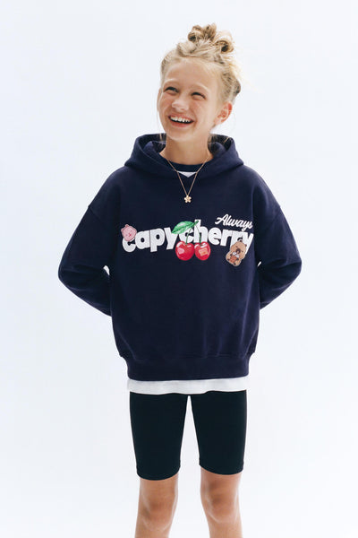 Kid wearing a navy CapyFun capybara hoodie